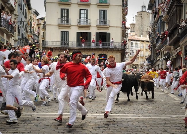 20 Amazing Festivals Around The World You Need To Visit Once In Your Life running of the bulls — pamplona, spain
