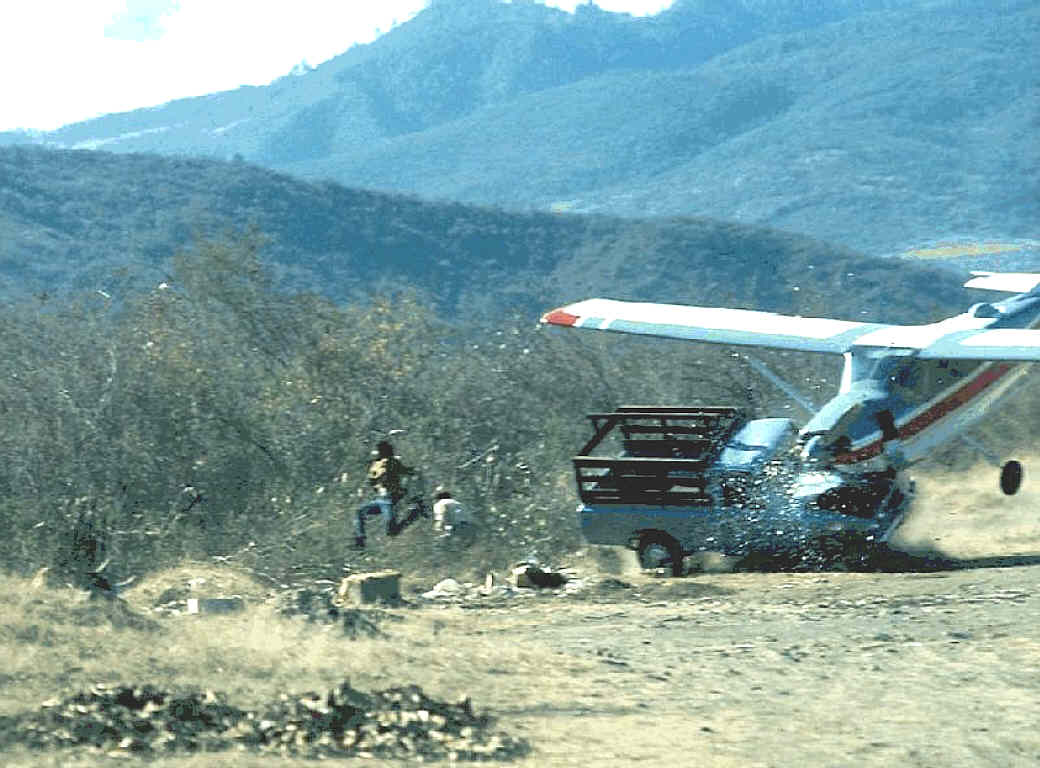 due to strong crosswinds, a landing plane crashes with a truck standing near the runway, 1976
