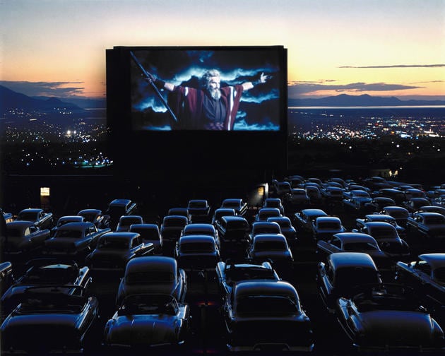 Photos of 38 Rarely Seen Moments of World History charlton heston as moses in “the ten commandments,” drive-in theater, utah, 1958