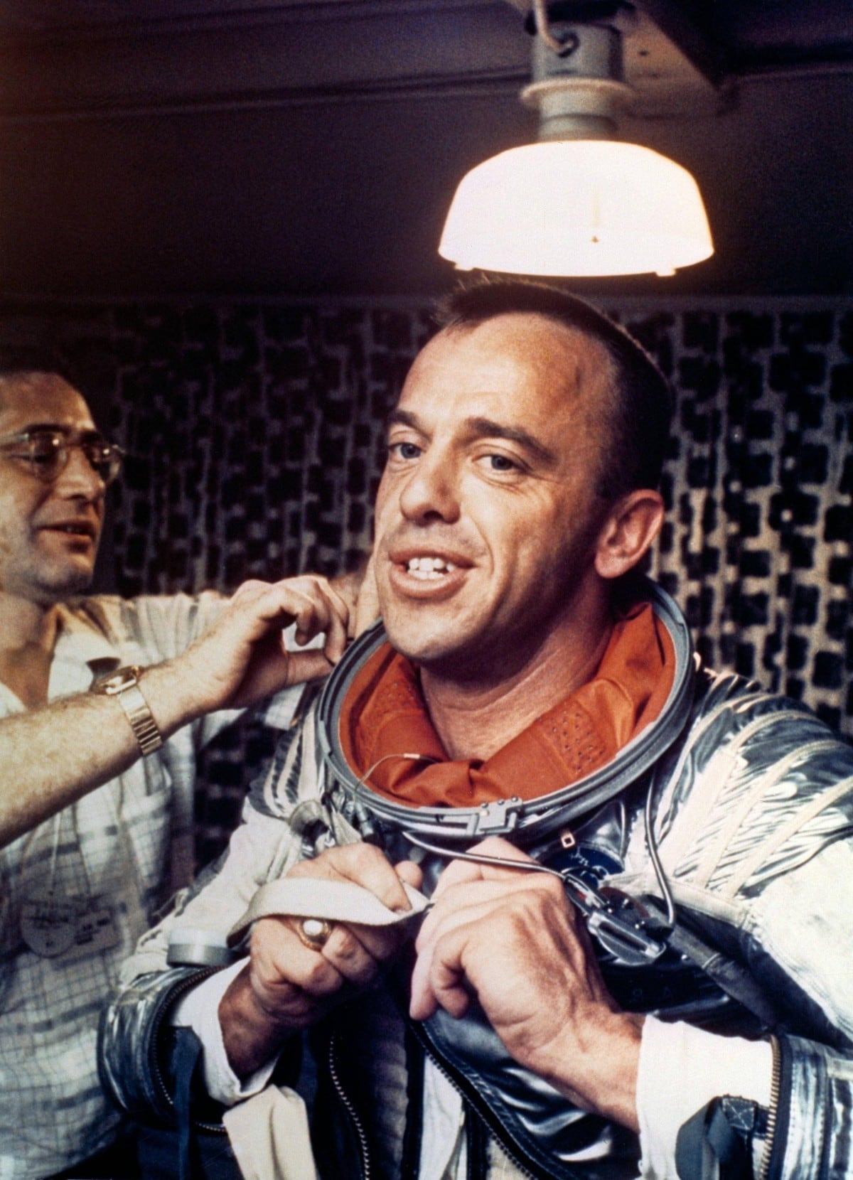 alan shepard, america's first man in space, puts on his navy mark iv spacesuit