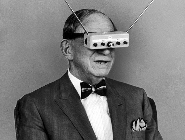 inventor hugo gernsback is demonstrating his television goggles in 1963