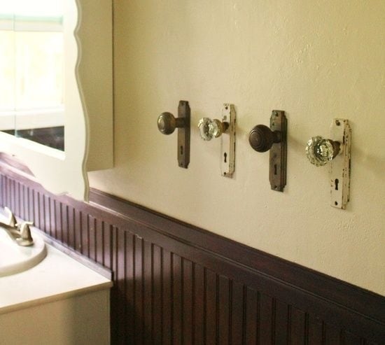 Use old door knobs for hanging towels.