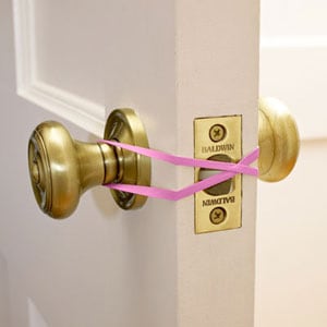 Use a rubberband if you want to keep your door open. (For example, when you're carrying groceries.)