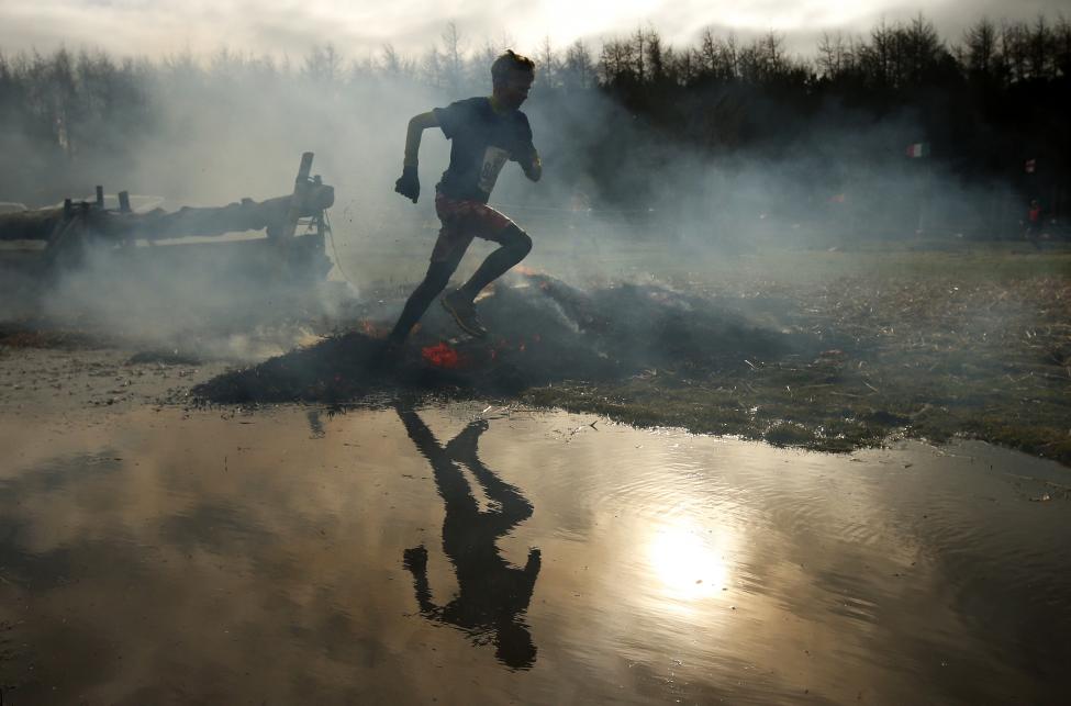 13 Photos From The 2015 Tough Guy Race A competitors run through smoke and flames during the Tough Guy event in Perton, central England