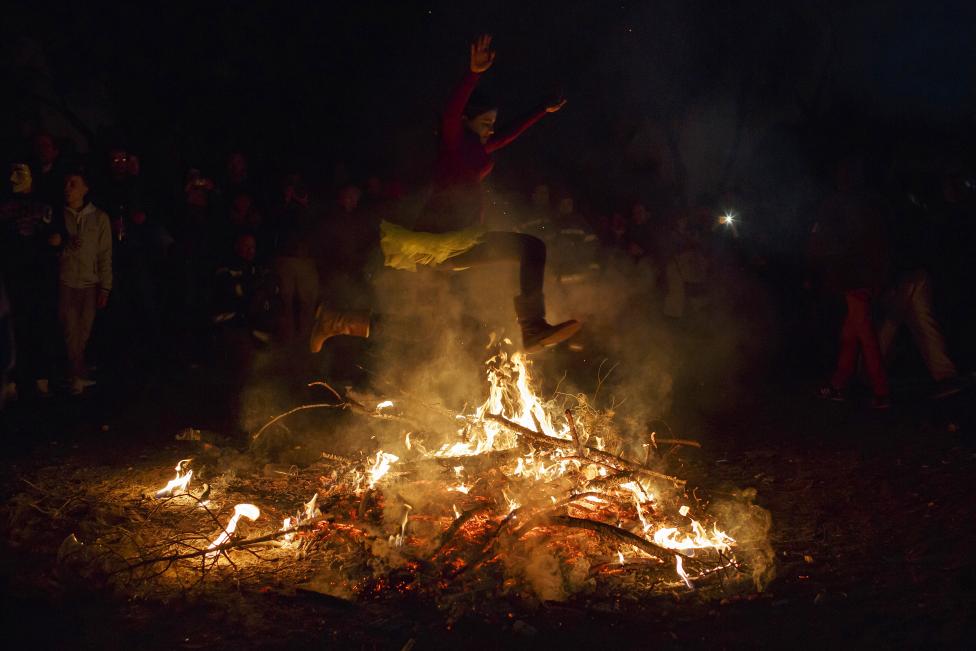 Crazy and Wonderful Photos from Carnivals Around the World 2015 a girl jumps over the fire during the "the burial of the sardine" funeral procession, which marks the end of carnival festivities, in madrid