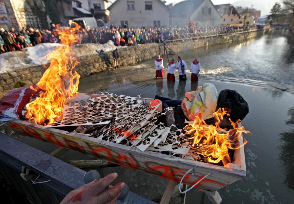 people burn the pust effigy at the end of the pust carnival in cerknica