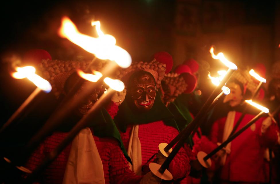 Crazy and Wonderful Photos from Carnivals Around the World 2015 revellers in traditional costumes and carnival masks parade through the village of elzach in the black forest