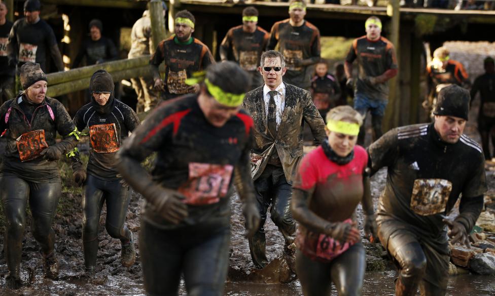 13 Photos From The 2015 Tough Guy Race Competitors run through mud during the Tough Guy event in Perton, central England