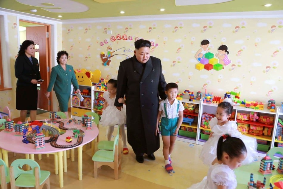 North Korean leader Kim Jong Un (C) visits the Pyongyang Baby Home and Orphanage on New Years Day in this photo released by North Korea's Korean Central News Agency (KCNA) in Pyongyang January 2, 2015. (Photo by Reuters/KCNA)