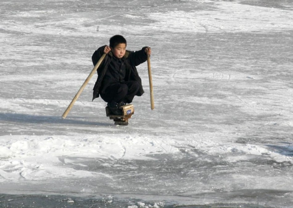 A North Korean boy skates on the ice of the Yalu River at the border to China near the North Korean city of Hyesan December 1, 2008. (Photo by Reinhard Krause/Reuters)