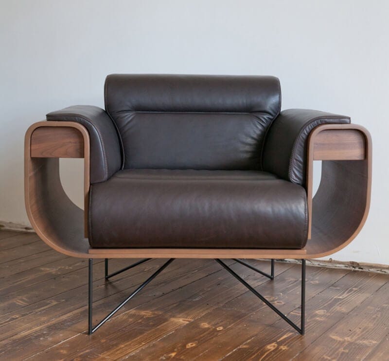 a brown leather chair in a room