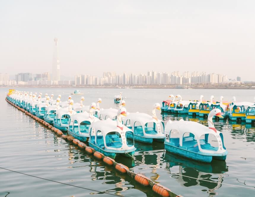 a boat is docked next to a body of water