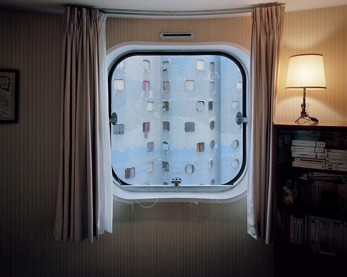 A Photographer Captured Modern Paris Through Retro Porthole Windows Of ... - Popcorn Windows Bourges Handrail