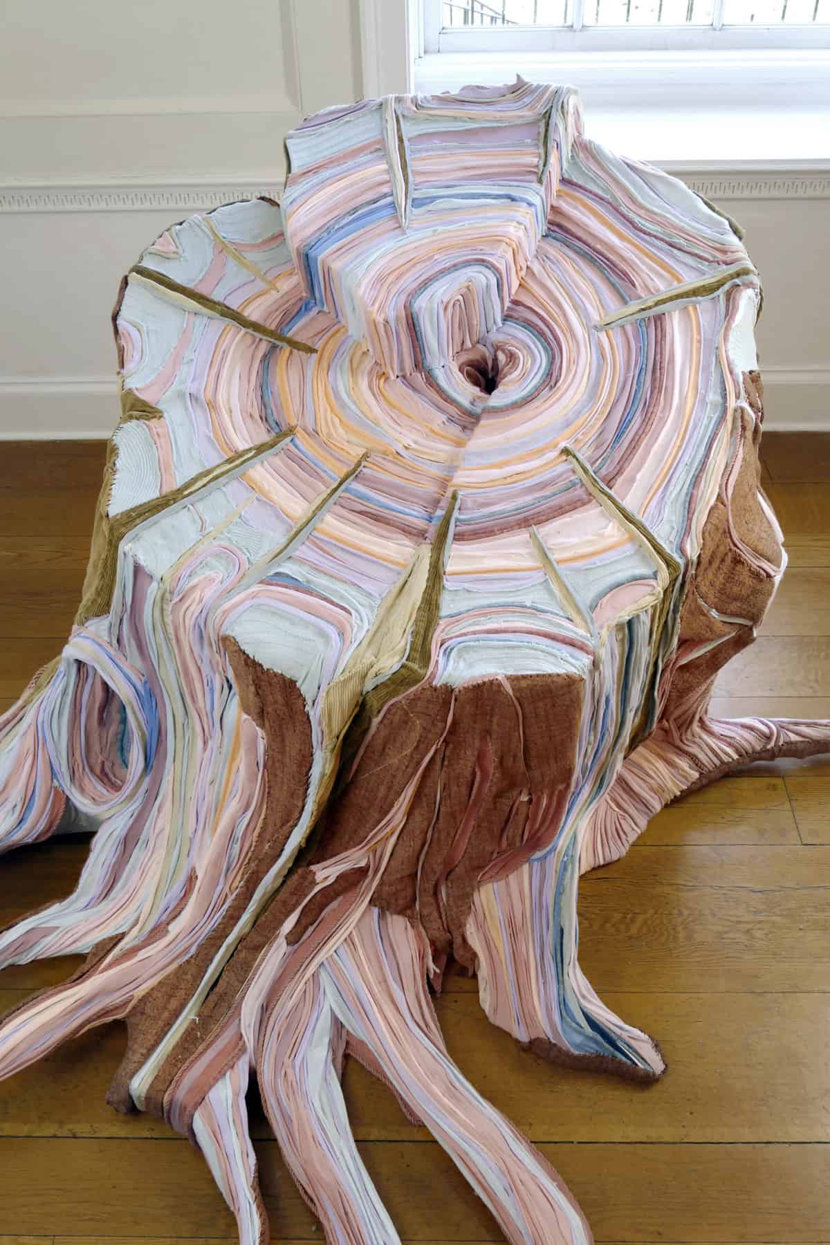 An Artist Creates Realistic Fabric Tree Stumps from Strips of Fabric and Discarded Clothing