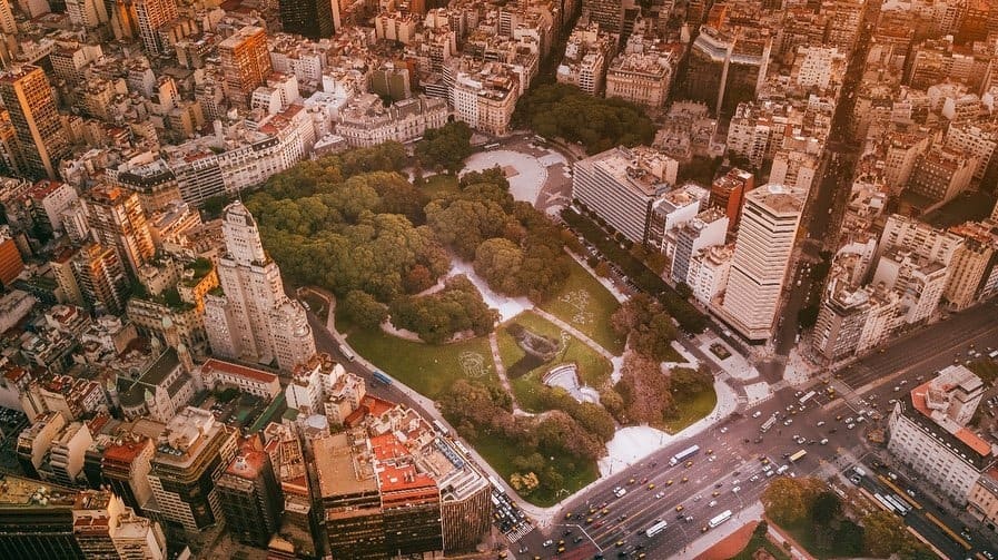 The artist paints 55,000 square feet of grass to celebrate International Recycling Day