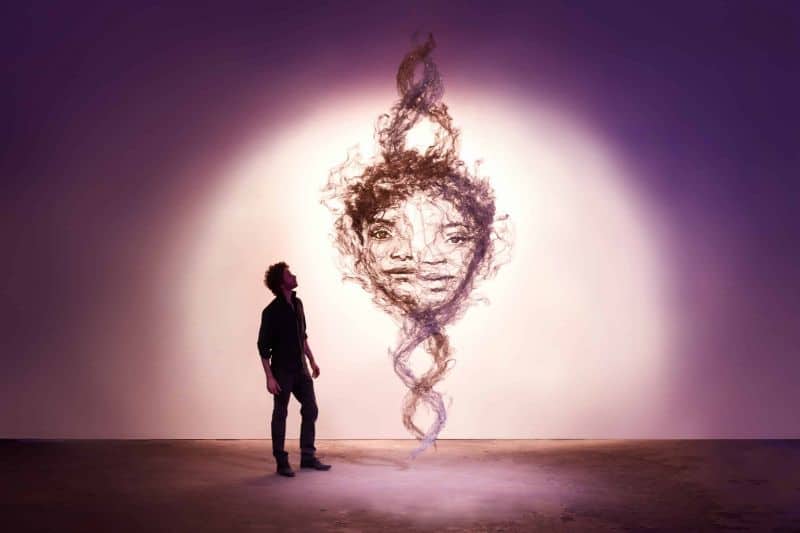 Artist Benjamin Shine creates huge calm faces from tulle fabric