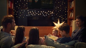 family enjoying movie night at home together PPYBLEG
