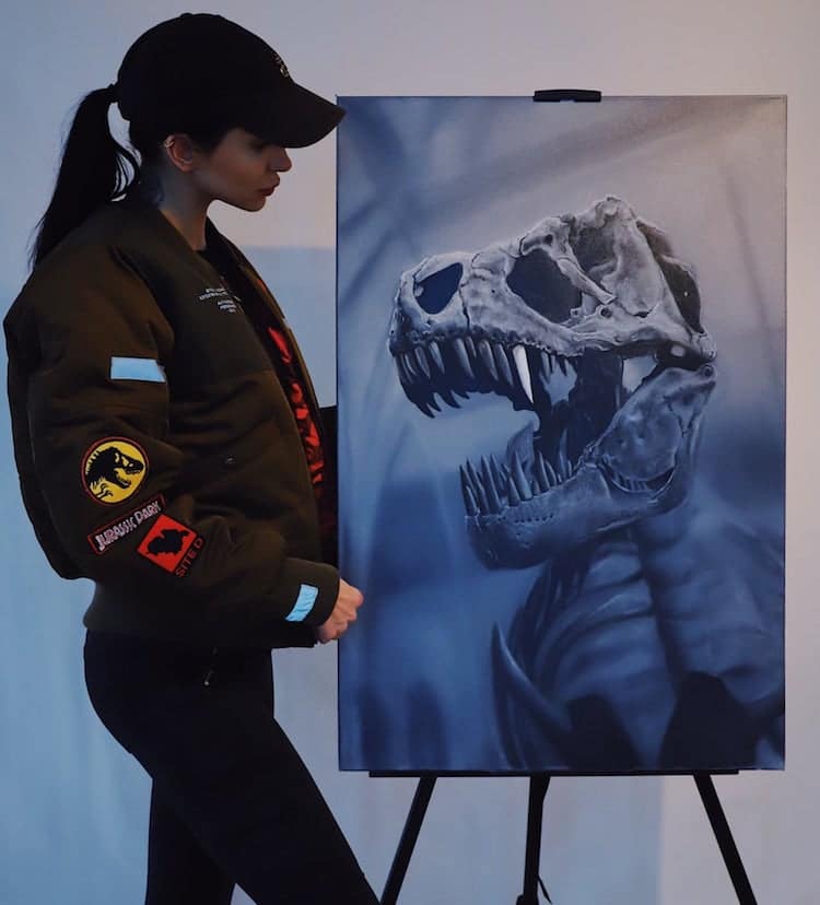 The artist pays homage to prehistoric animals through oil paintings