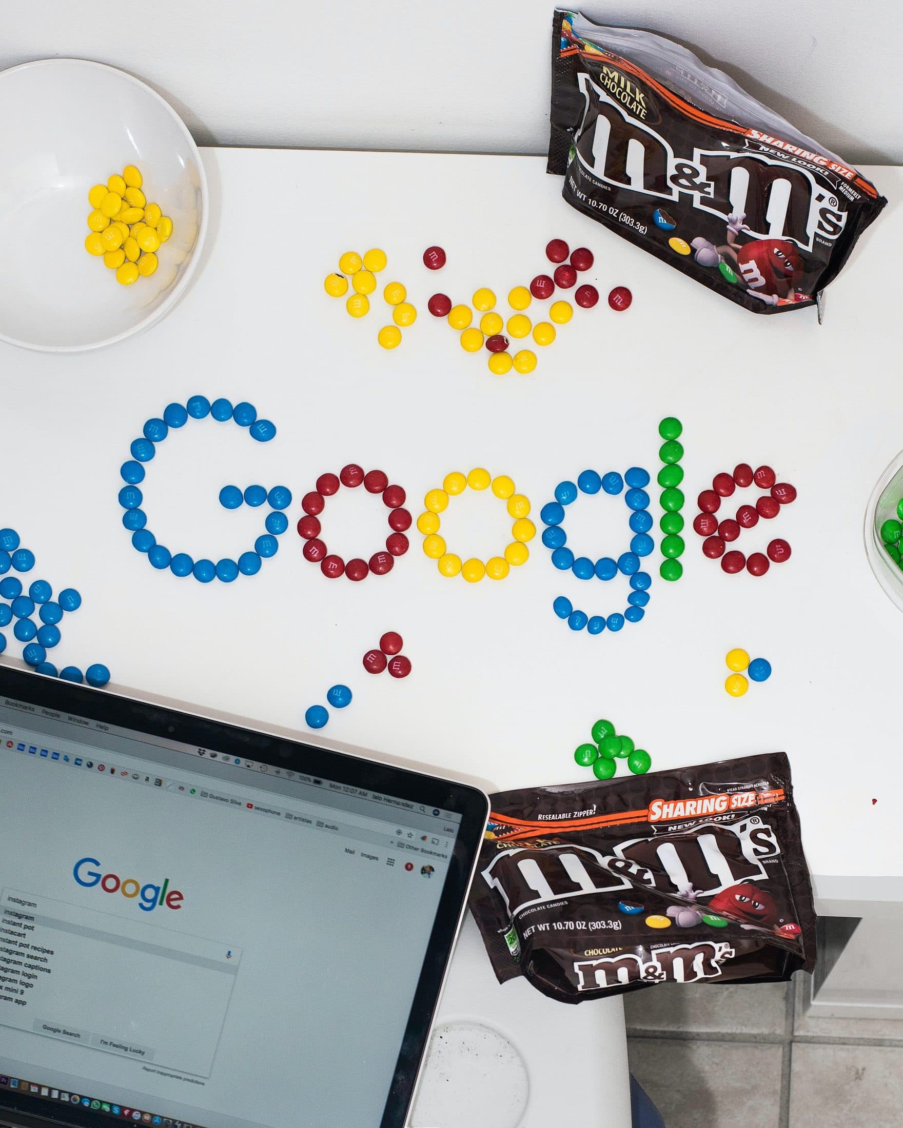 photo of M&M forming Google chocolate candies on table