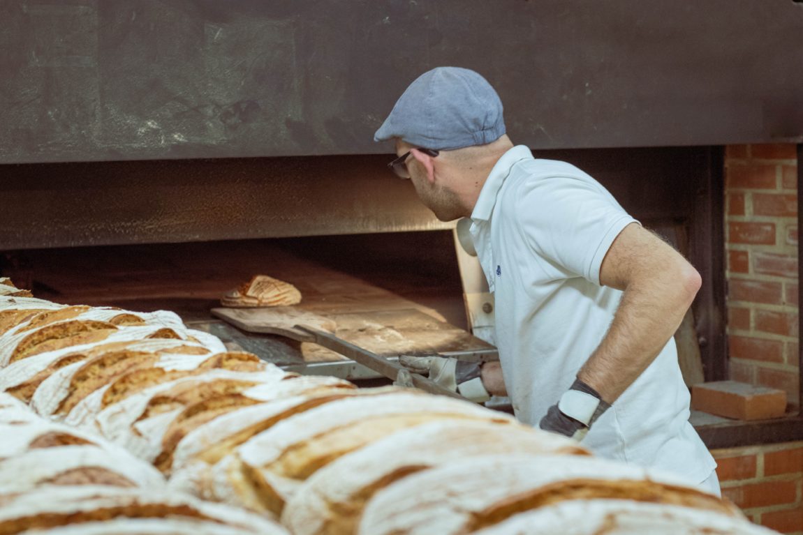 Baker man wearing white polo shirt