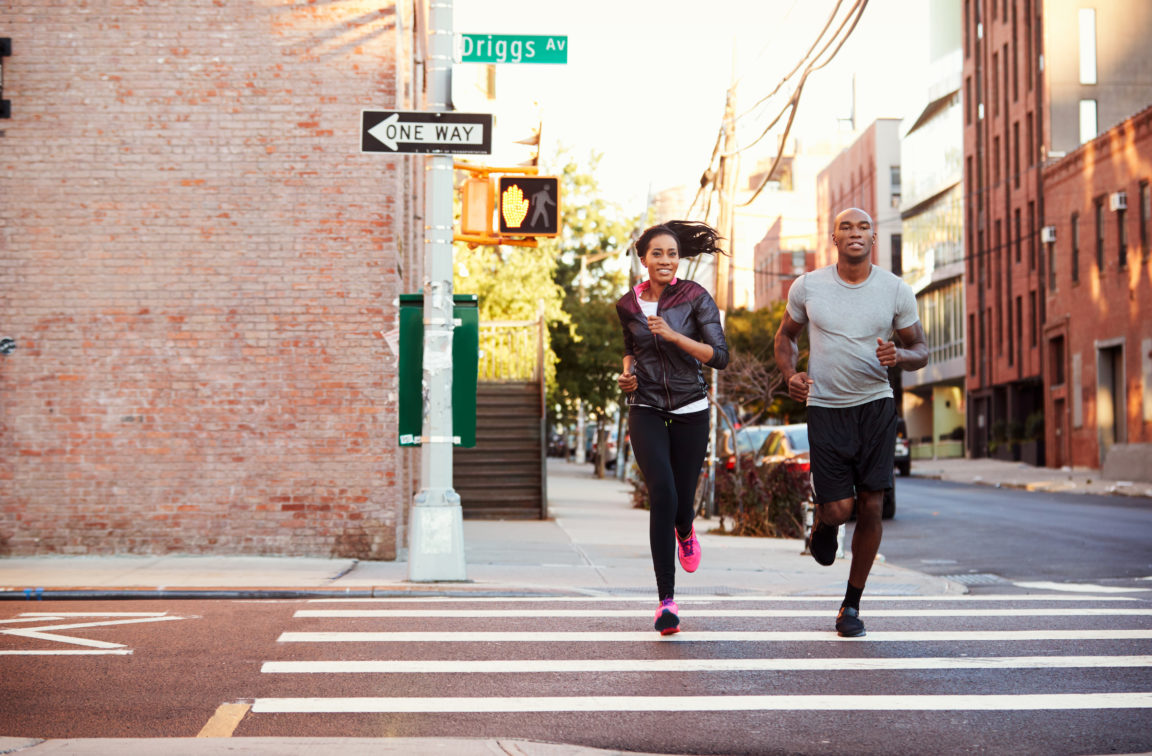young black couple jogging in brooklyn street