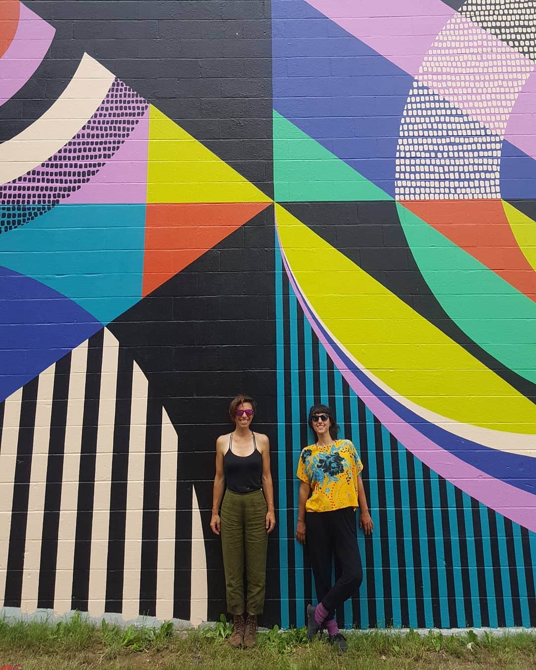 Artists Jessie and Katey bring life and colors into an old and boring structure