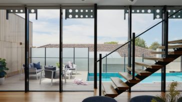 brown wooden table and chairs on white floor tiles