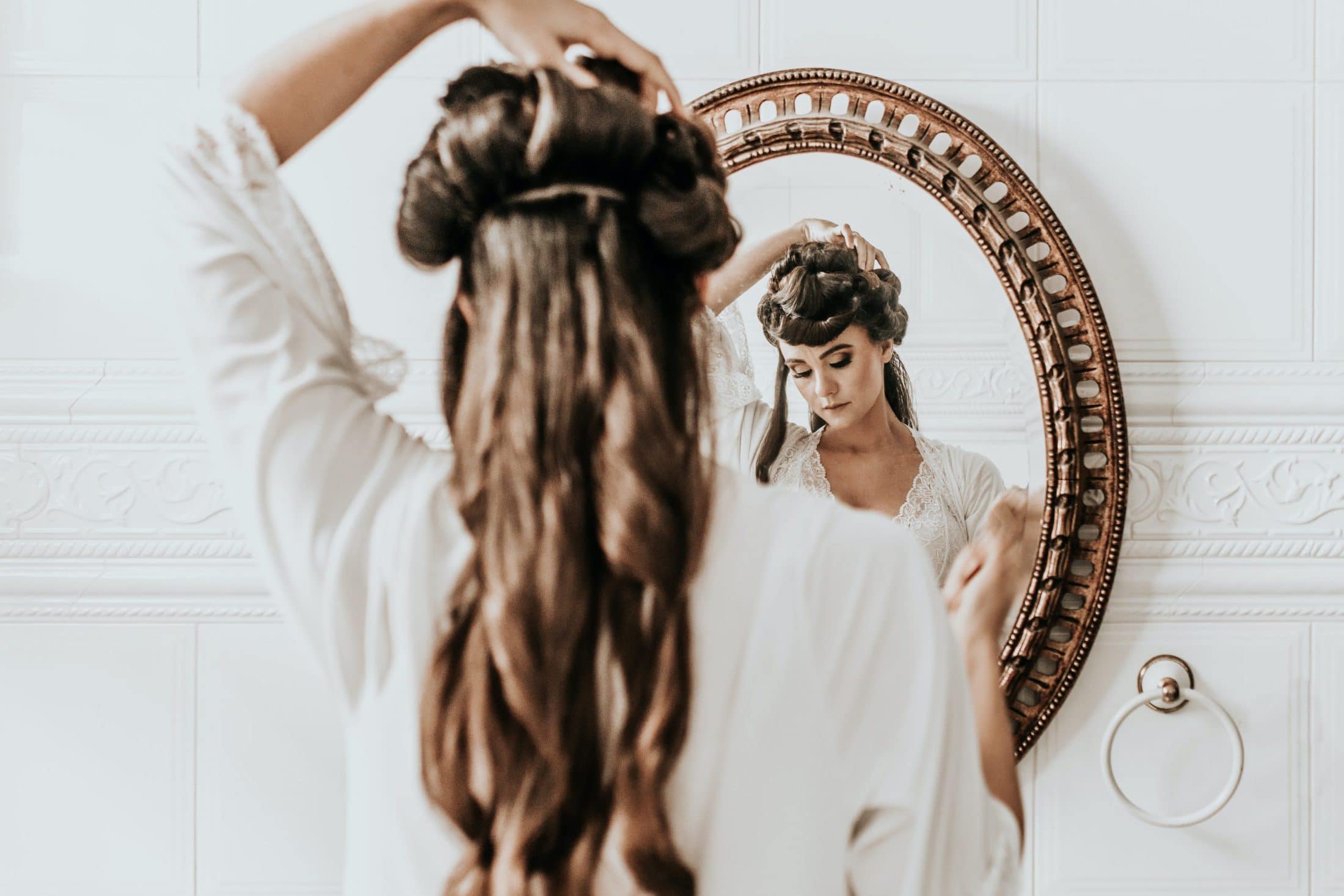 What to Do to Have Healthy Hair woman wearing white dress standing in front of mirror