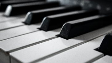 grayscale photography of piano