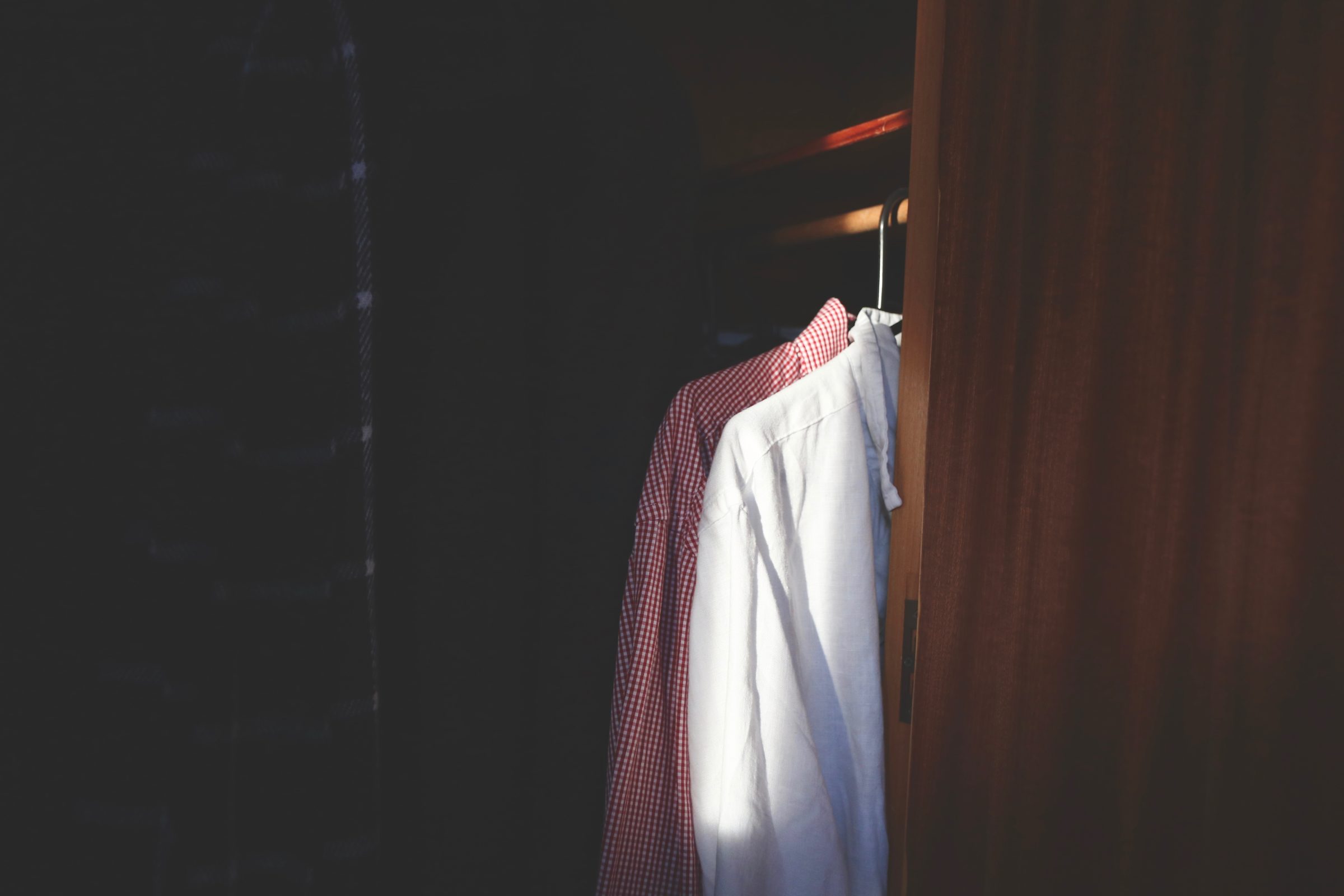 shirts hanging in a wardrobe K6EFX8F