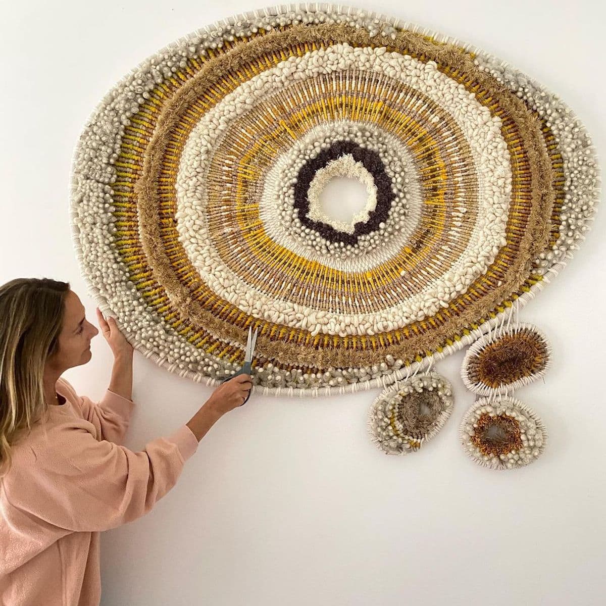 Artist Tammy Kanat creates large-scale woven wall hangings full of colors