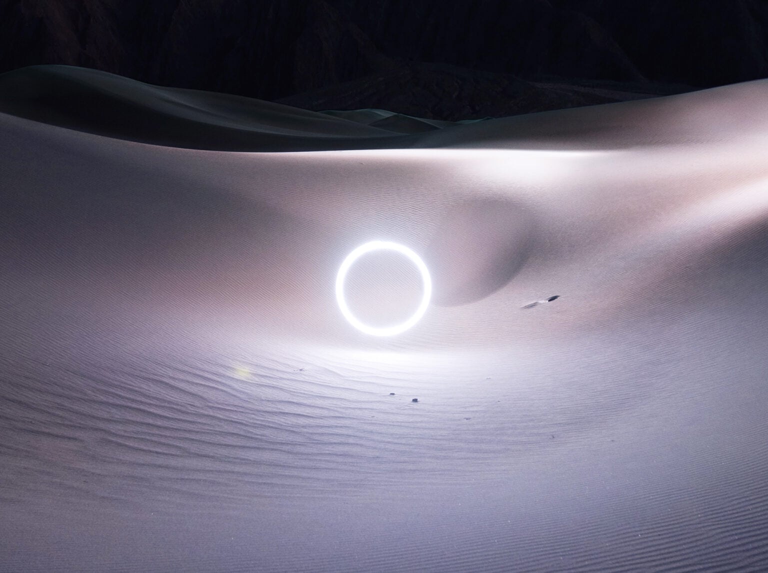 Watch Reuben Wu's glowing geometric shapes emerge from nothingness in this video