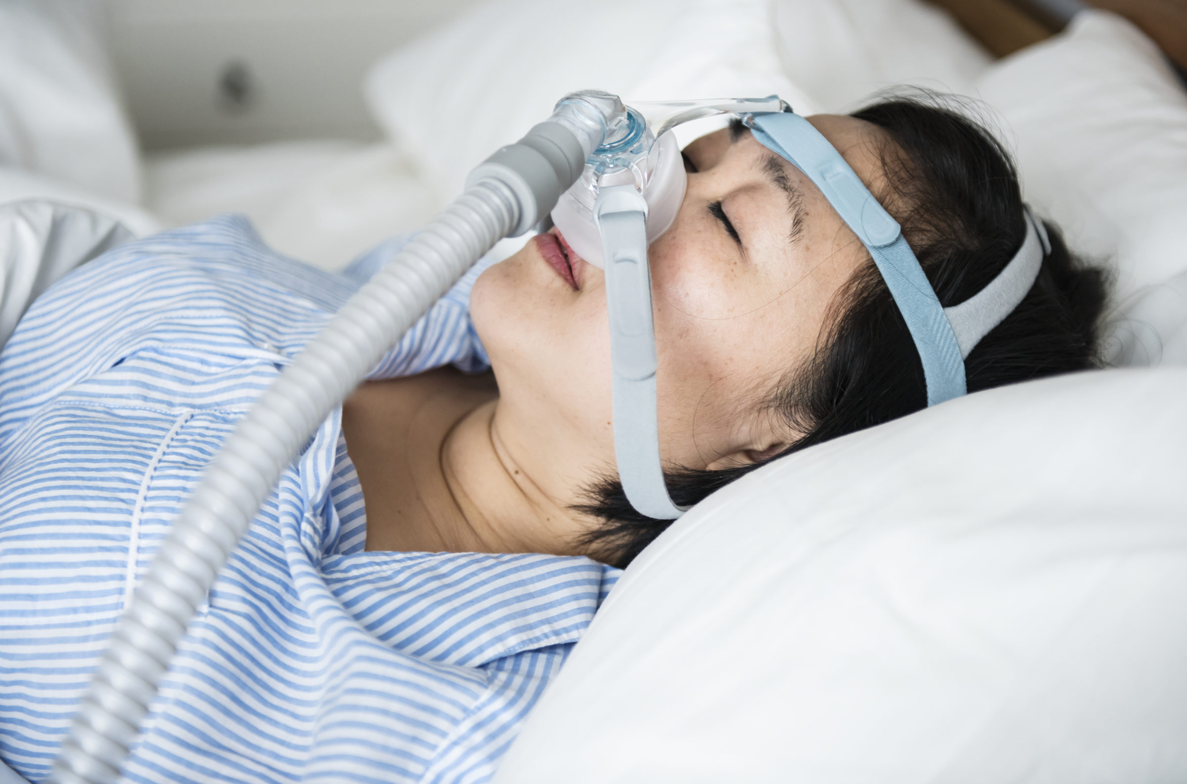 a woman wearing anti snoring chin straps NCP2WAS