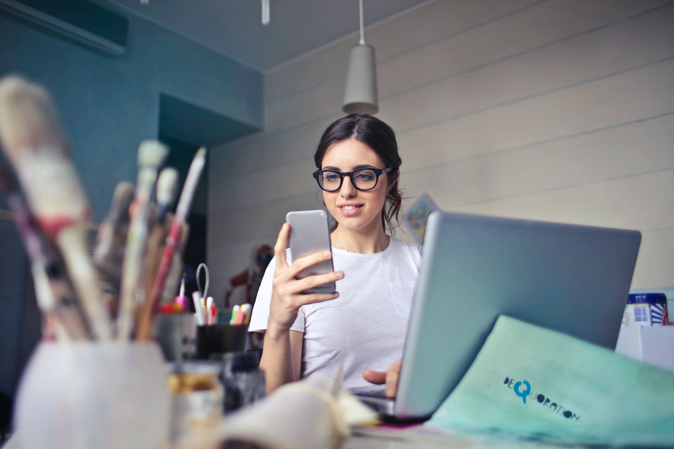 Six Reasons Why Business Analytics is Important in Today's Era woman in white shirt using smartphone