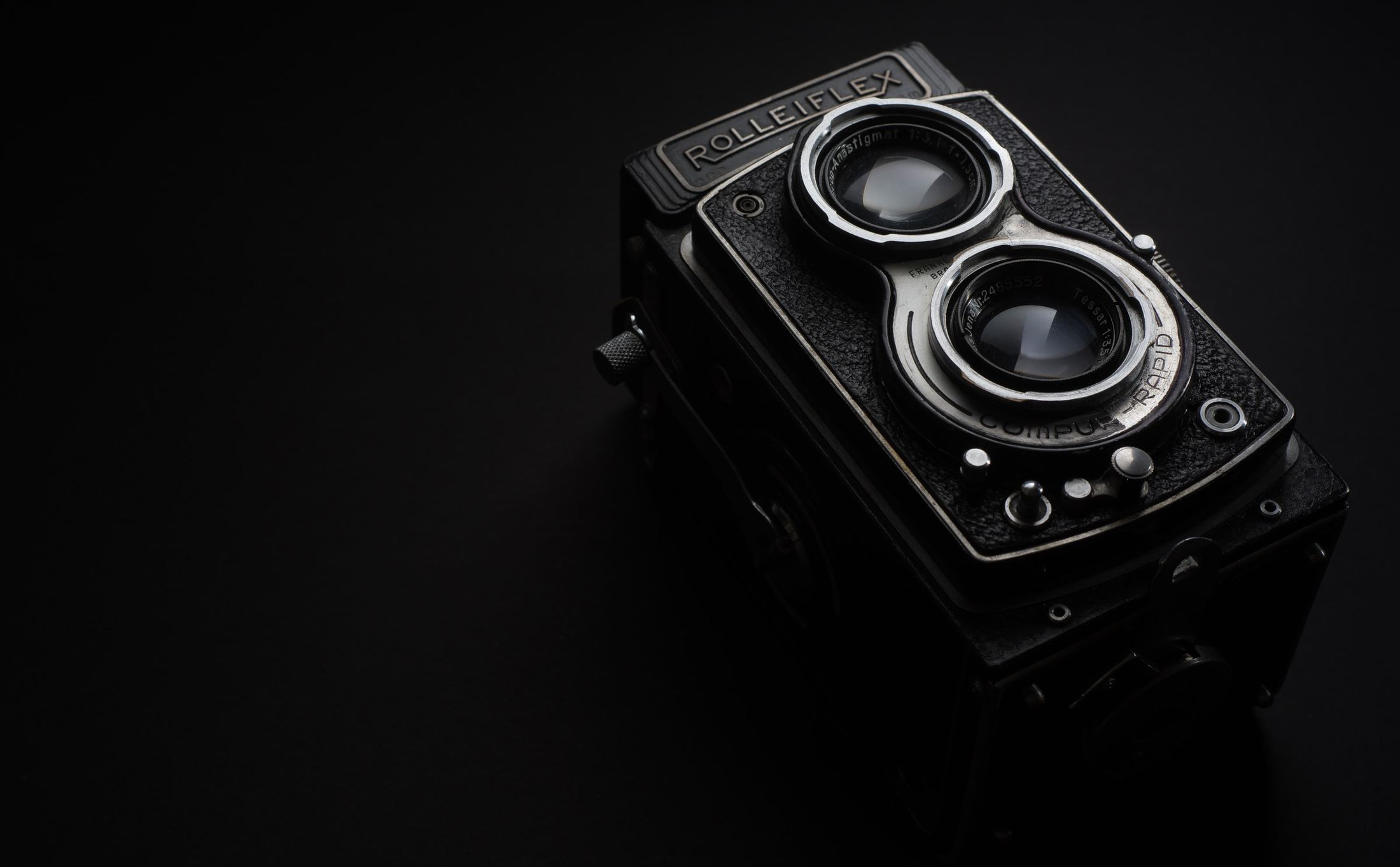 What Is the Biggest Difference Between the SLR and DSLR? black rolleiflex camera grayscale photo