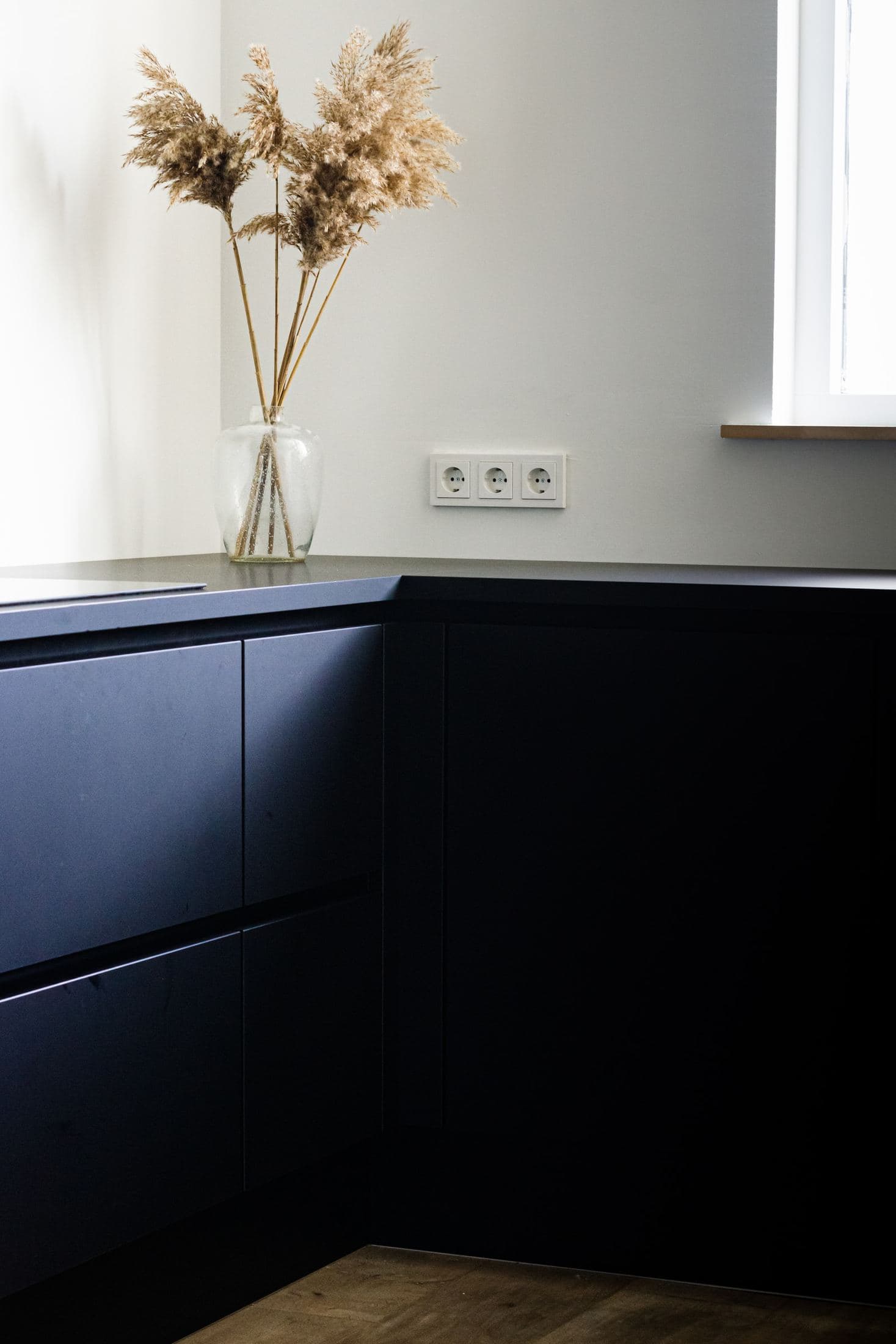 black wooden cabinet near white wall