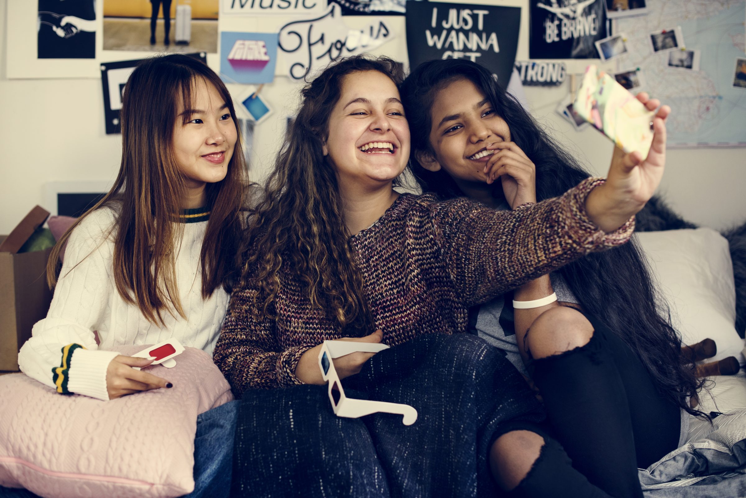 teenage girls using a smartphone to take a selfie 2021 08 27 00 04 37 utc