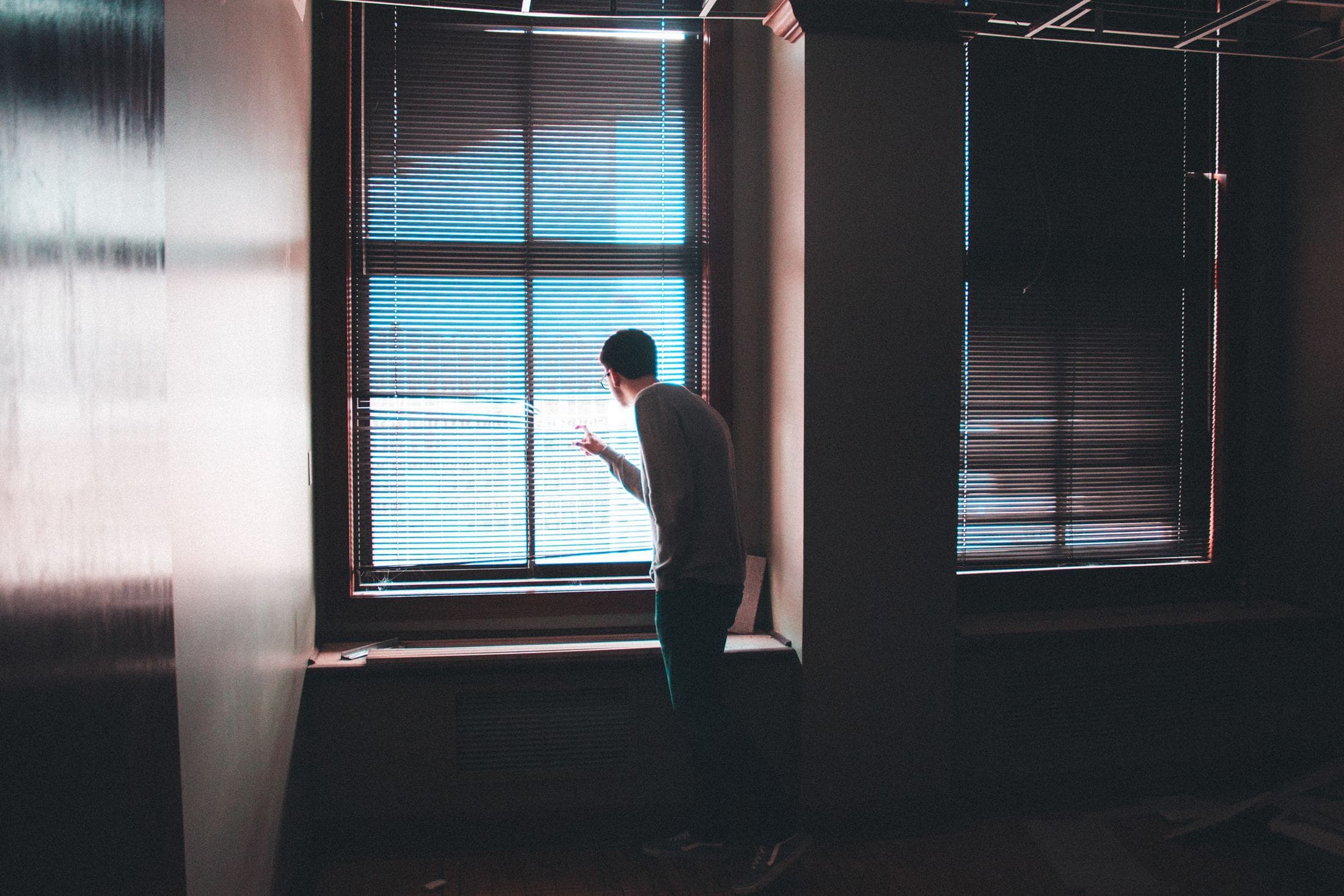 5 Tips to protect your interior from the vis-à-vis man standing near window inside building