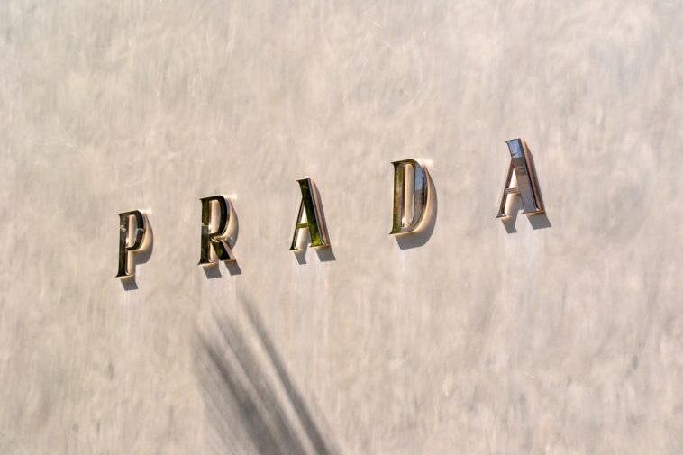 Prada gold love letter letter on white surface