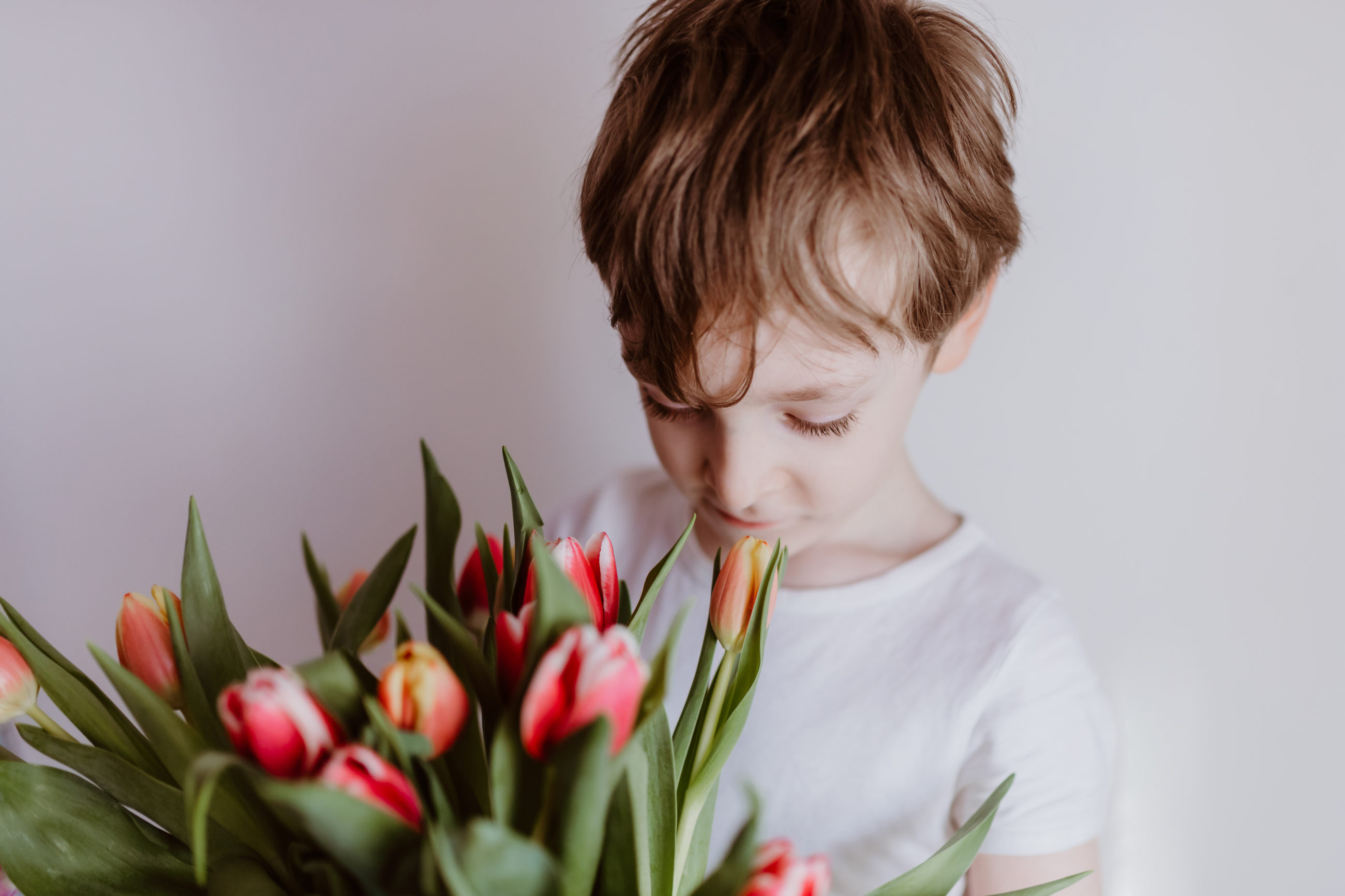 boy holding yellow tulips as gift for mom copy sp 2022 03 22 15 44 55 utc