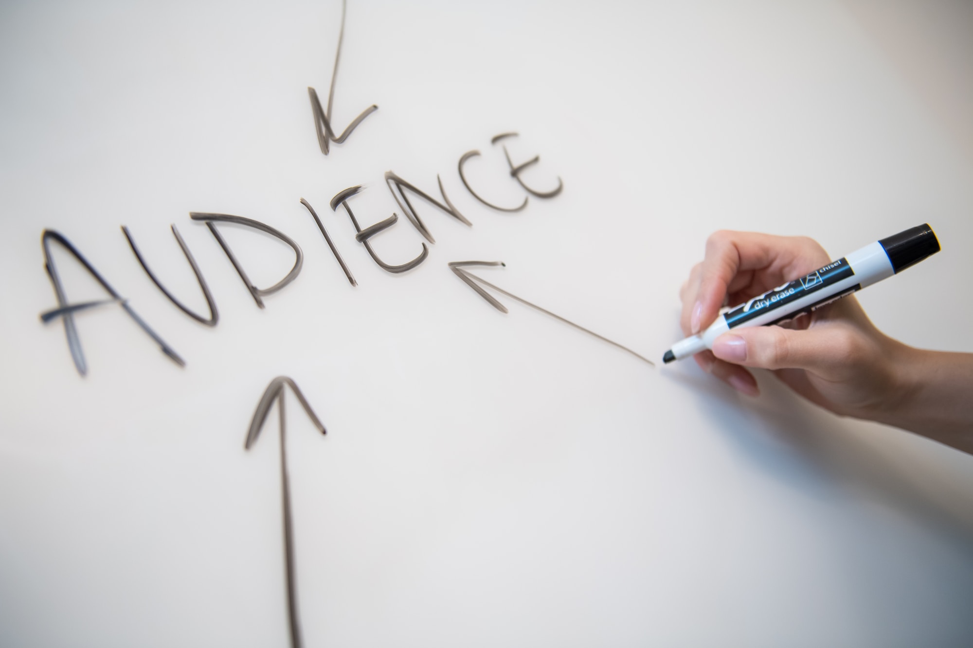 7 Essential Considerations in Curriculum Development person writing on white paper
