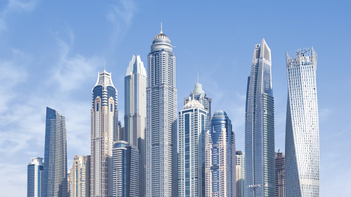concrete high-rise buildings under blue sky
