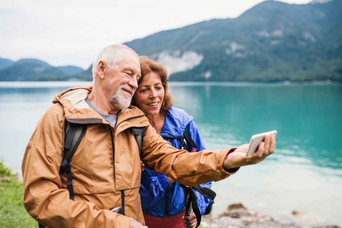 a senior pensioner couple standing by lake in natu 2022 02 02 04 48 41 utc