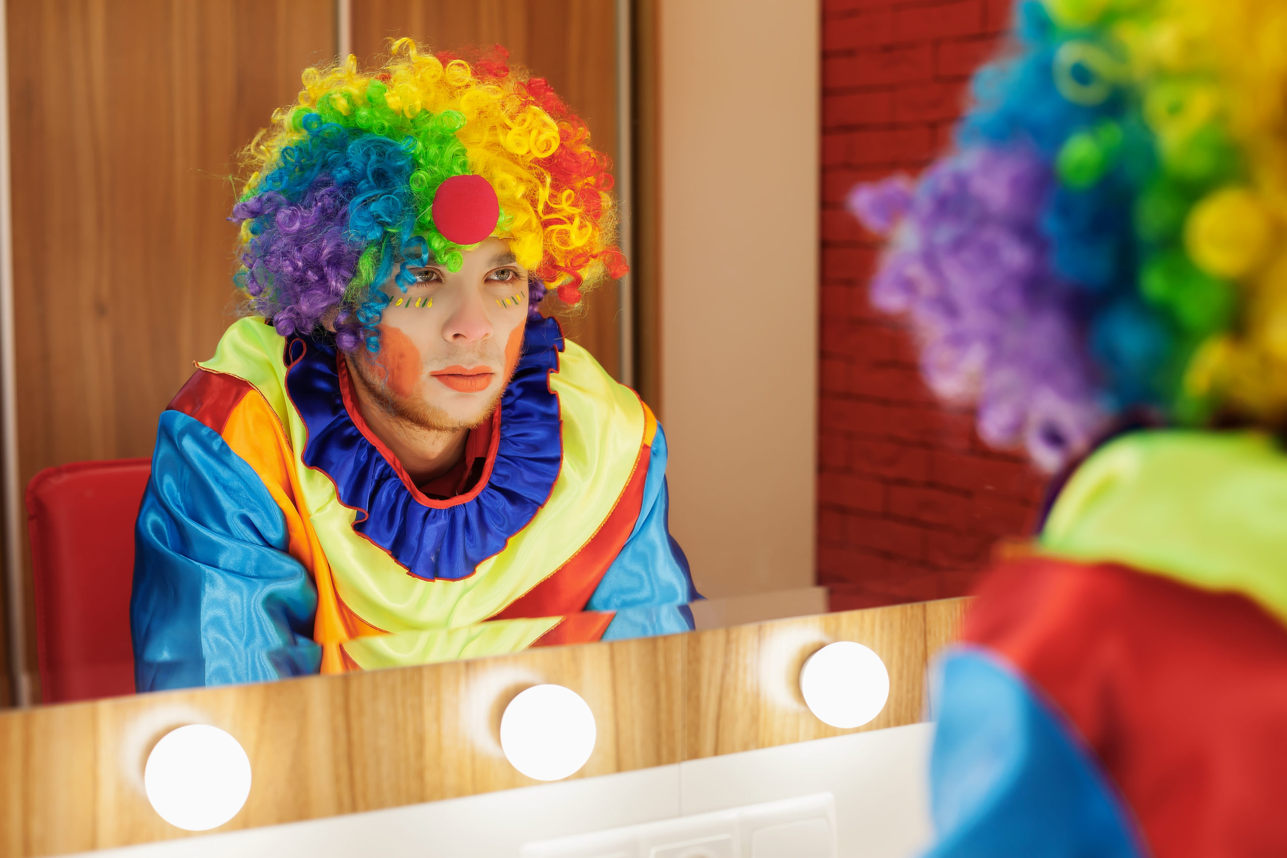 circus clown looks in a mirror in makeup room 2021 08 26 16 26 16 utc