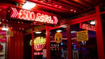 red and white coca cola neon signage