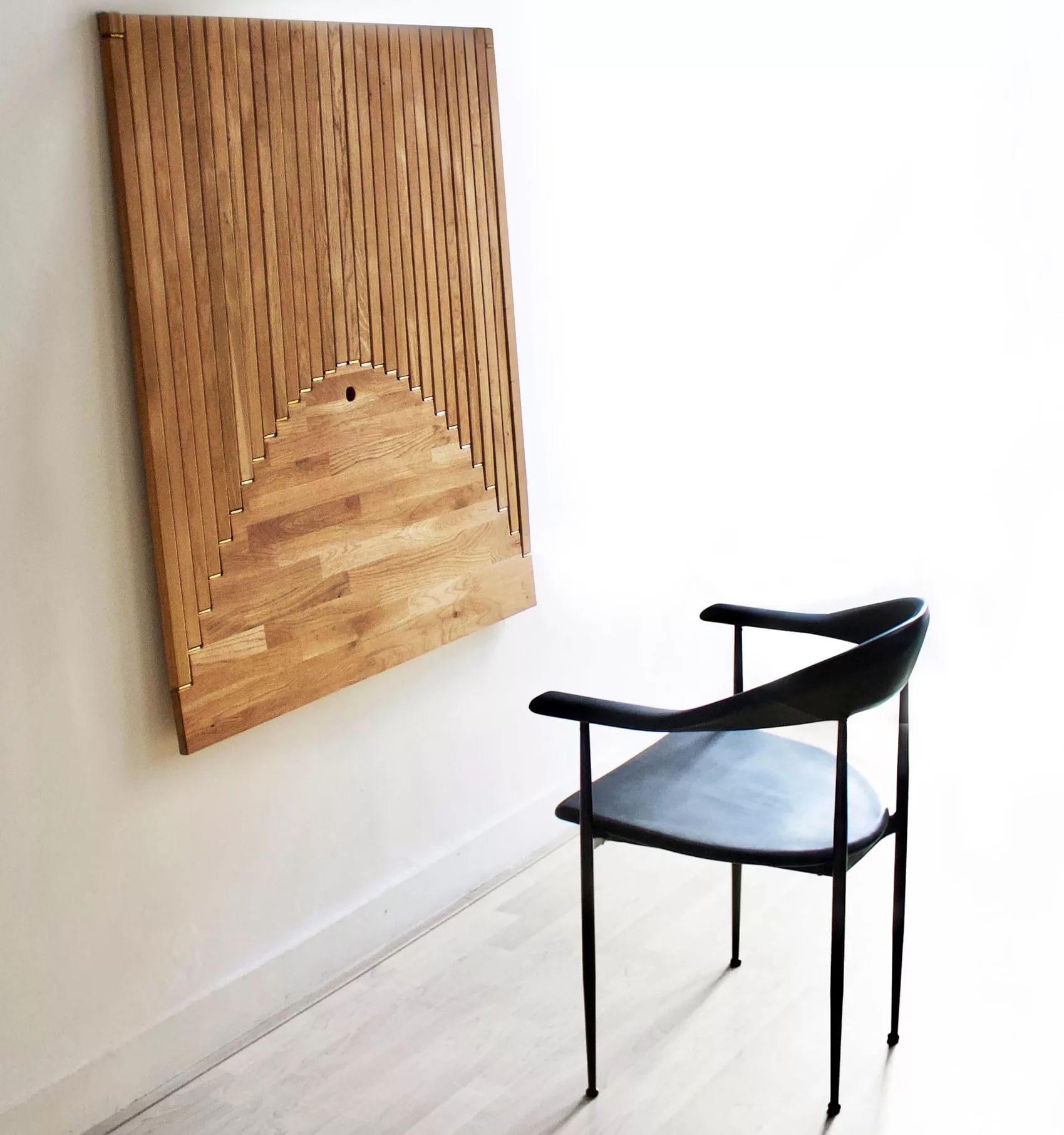 a chair sitting in front of a wooden table