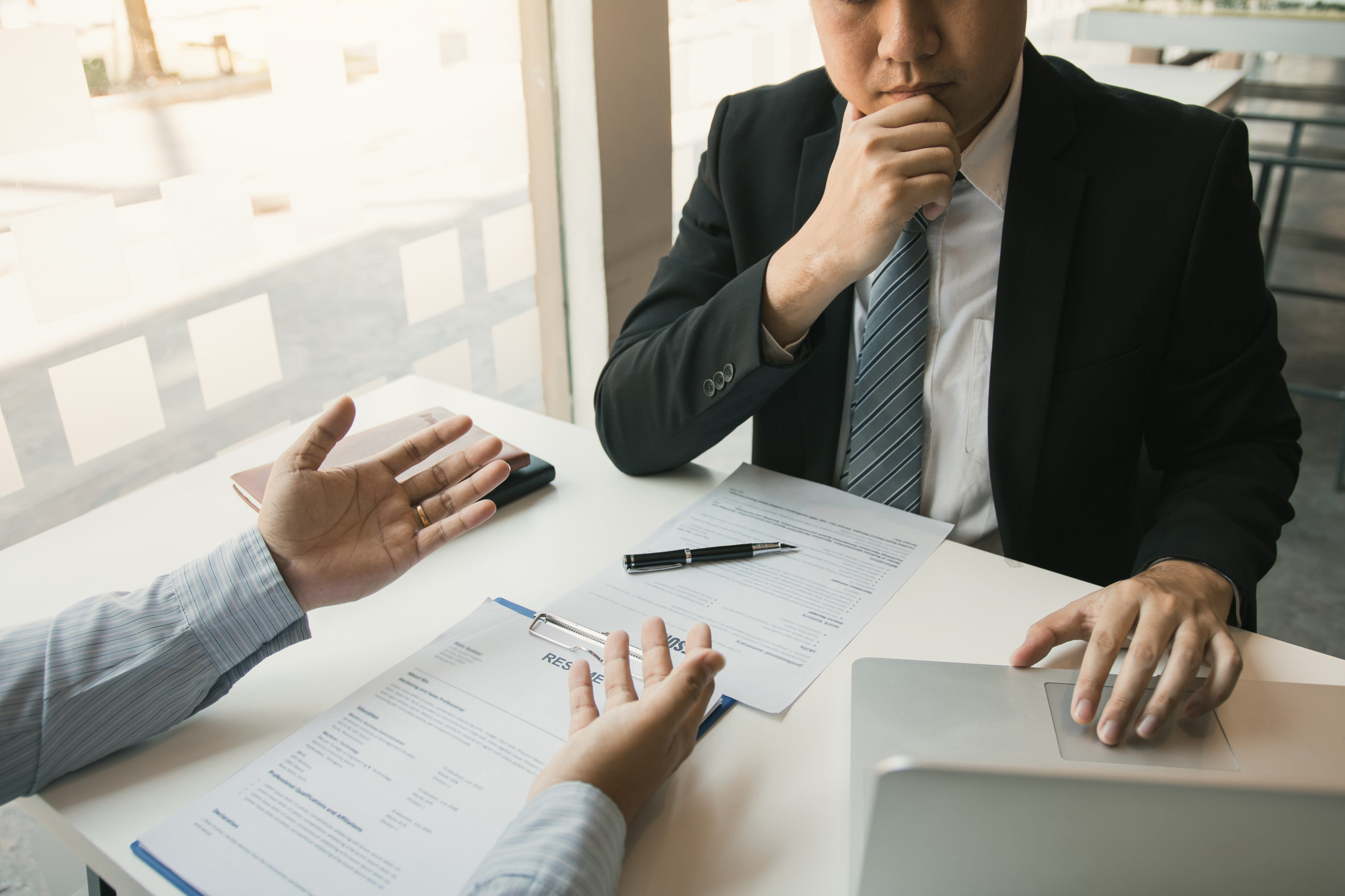 The Power of Work Experience – How to Leverage It to Get That Dream Job a man in a suit using a computer