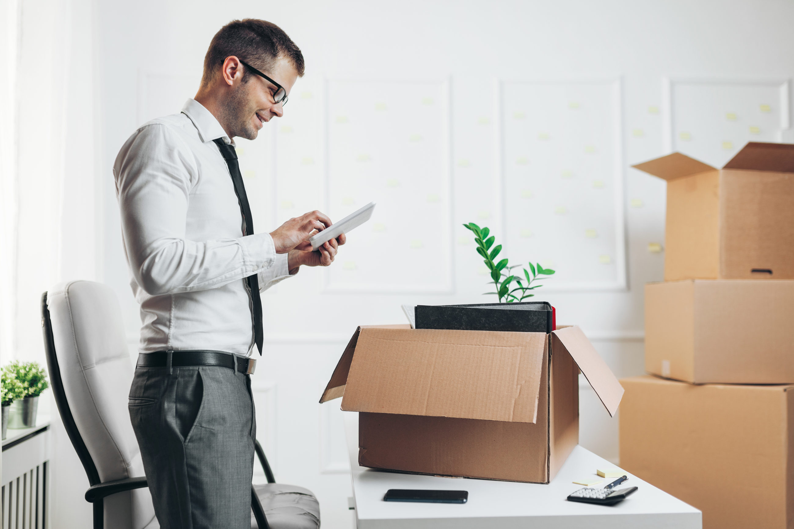 Moving on a Budget: Tips for Affordable NYC Moves a man standing in front of a box