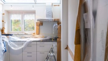 a kitchen with a sink and a shower curtain