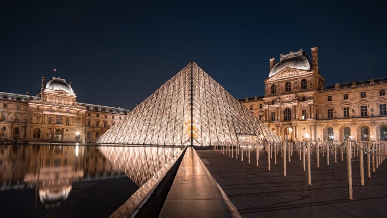 a large building in the background with louvre in the background